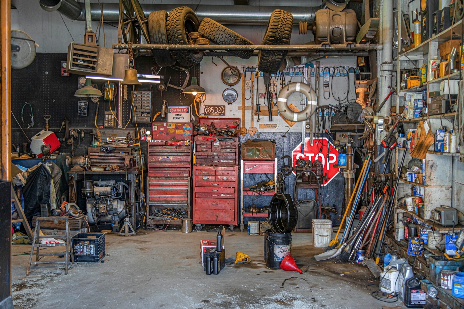 A barn-garage piled high with tools, tires, crates and decades of stuff — the kind of cleanout Kathy handles